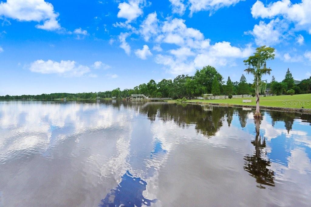 11715 Taylor Road Thonotosassa, FL 33592 - Photo 68 of 73 a view of a lake with houses in the back