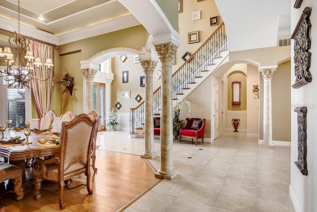 11715 Taylor Road Thonotosassa, FL 33592 - Photo 8 of 73 a living room with furniture gaming equipment and a chandelier