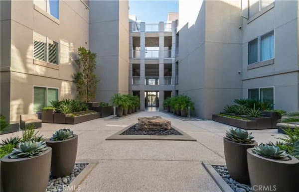 a view of a building with potted plants