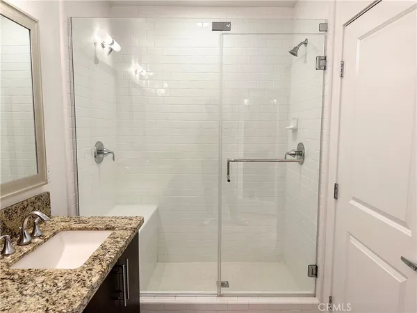 a bathroom with a toilet and a rug