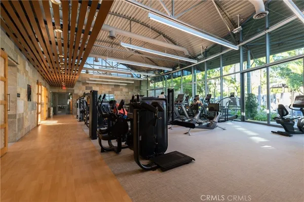 a view of a brick building with glass windows
