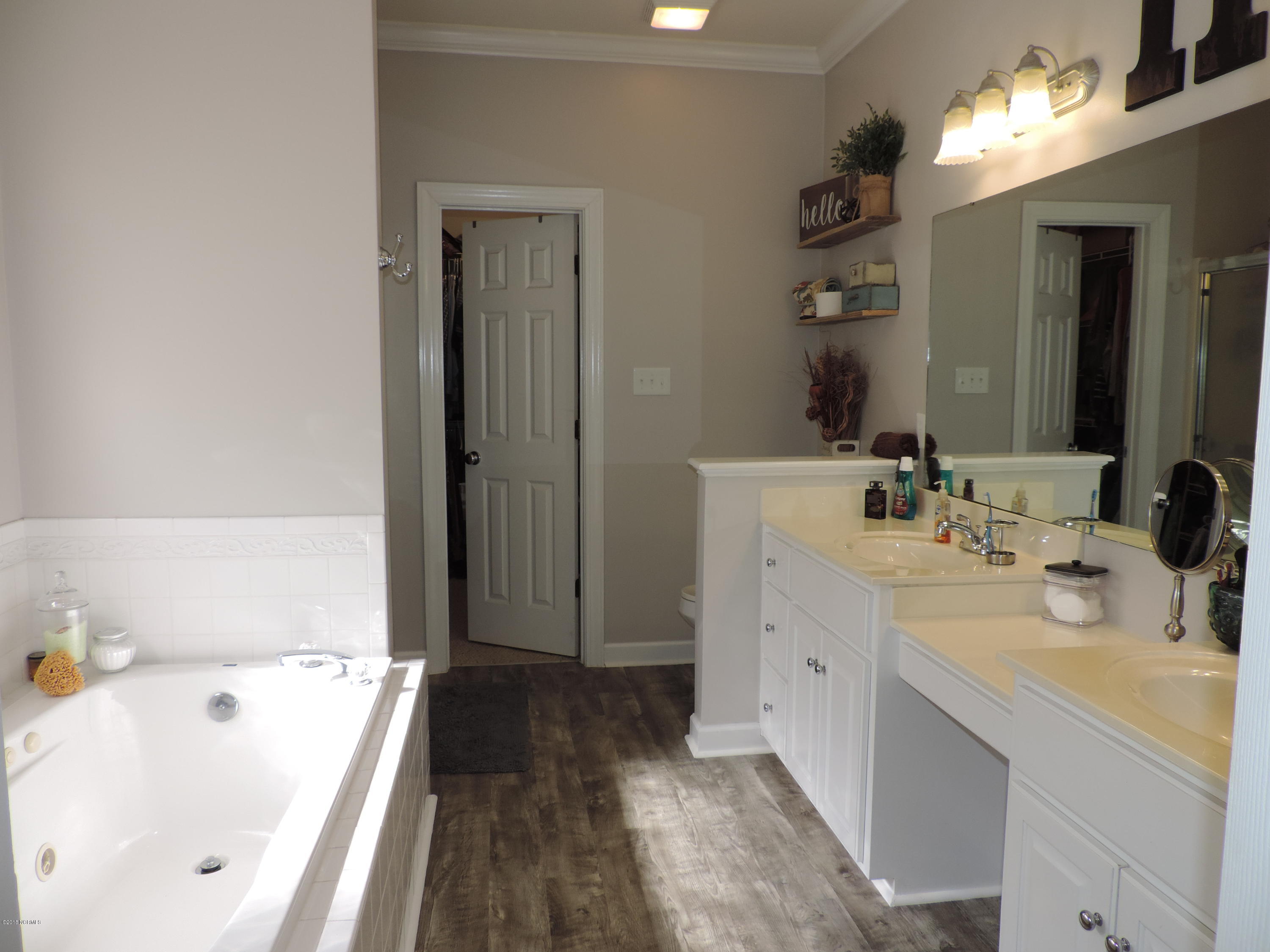 2121 Perrytown Loop Road New Bern, NC 28562 - Photo 14 of 35 Master bath double sinks, jetted-tub and walk-in closet