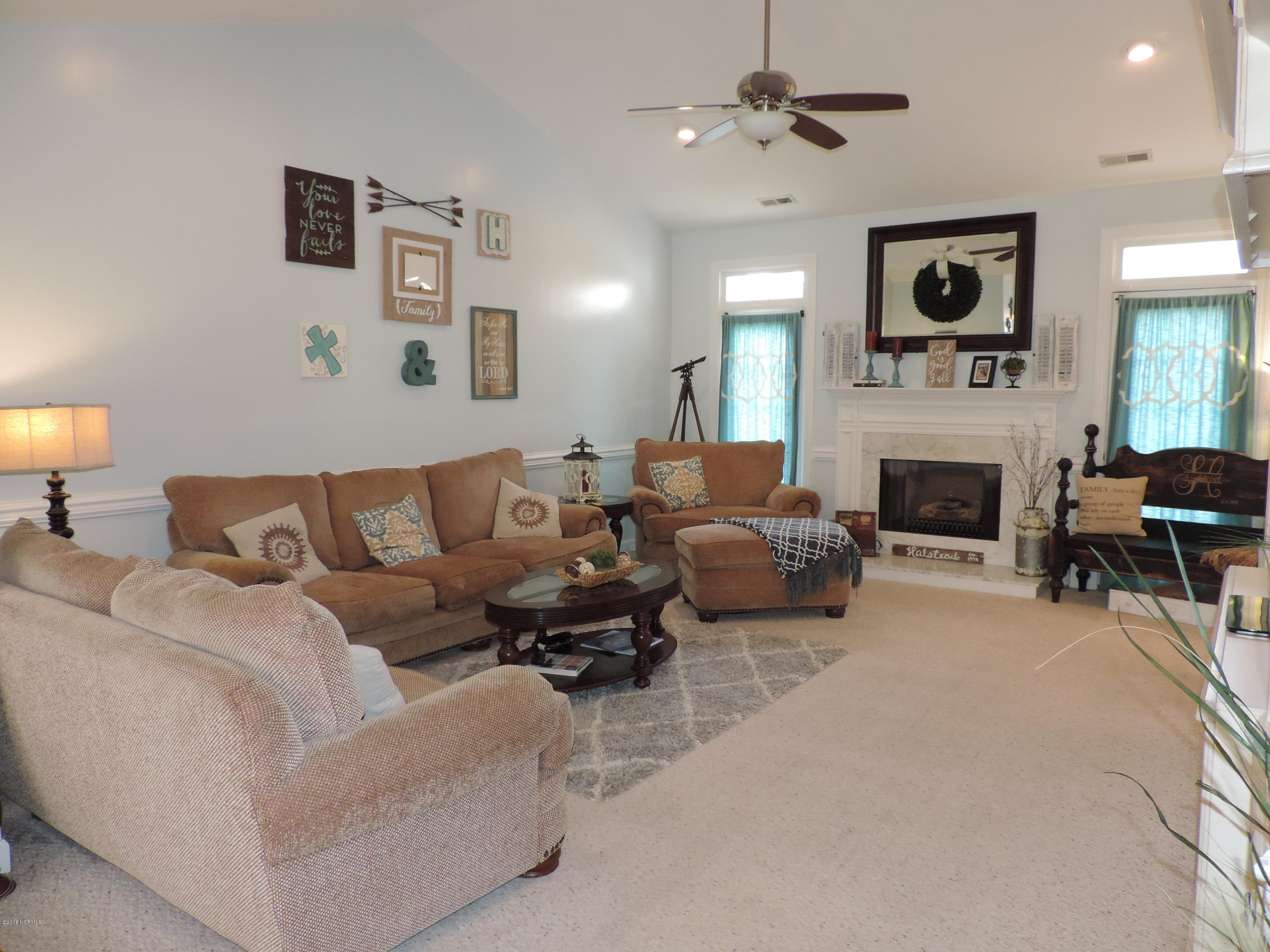 2121 Perrytown Loop Road New Bern, NC 28562 - Photo 7 of 35 Living room, cathedral ceiling, chair rail and fire place