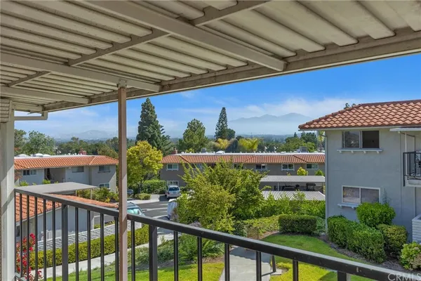 a view of a balcony with furniture