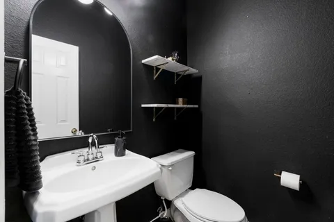 a bathroom with a sink and a toilet