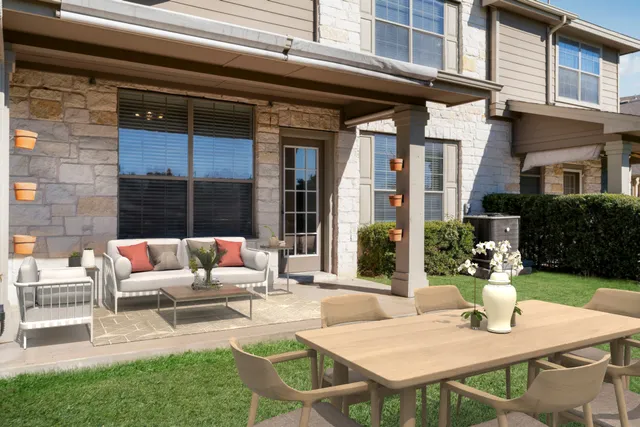 a view of a patio with couches table and chairs
