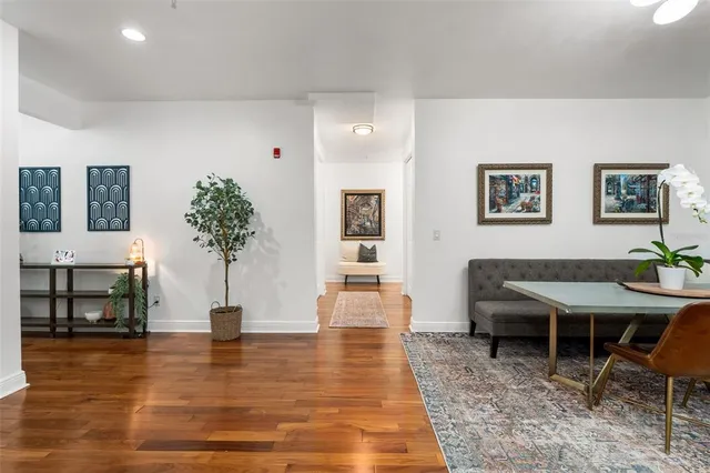 a view of a room with furniture and wooden floor