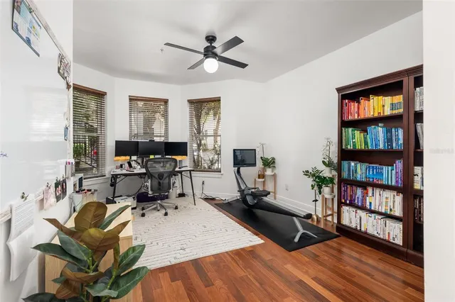 a bed room with a bed and a book shelf