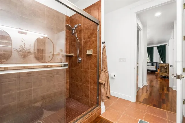 a bathroom with a glass shower door