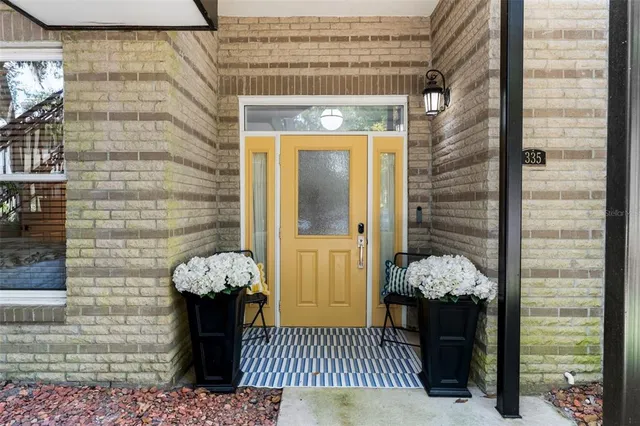 a front view of a house with a fountain