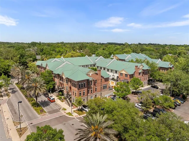 an aerial view of residential building and lake