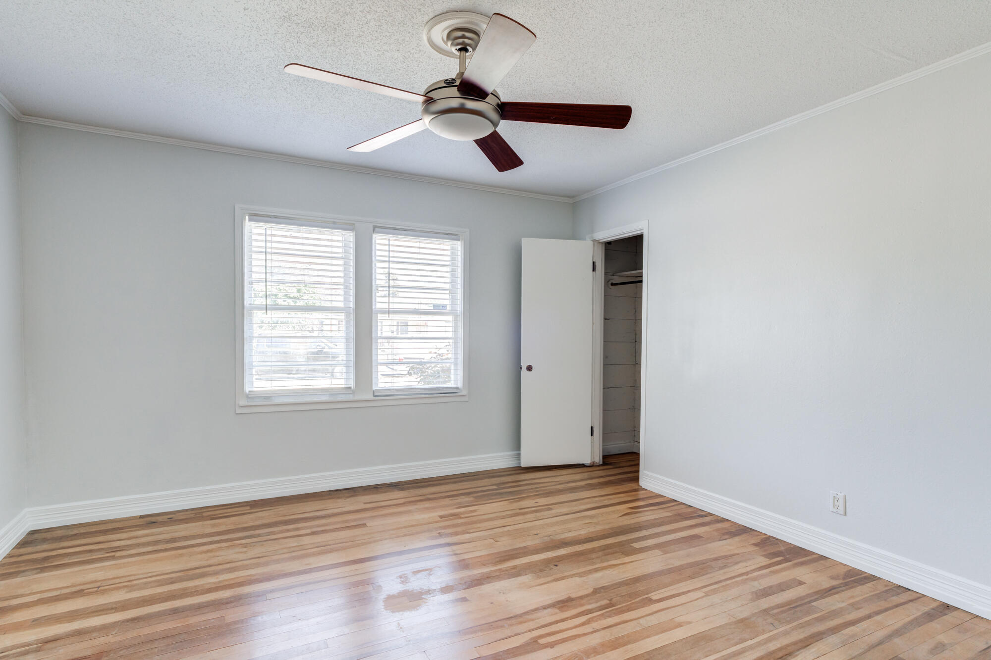 2629 24th Street Lubbock, TX 79410 - Photo 15 of 28 a view of room window and wooden floor