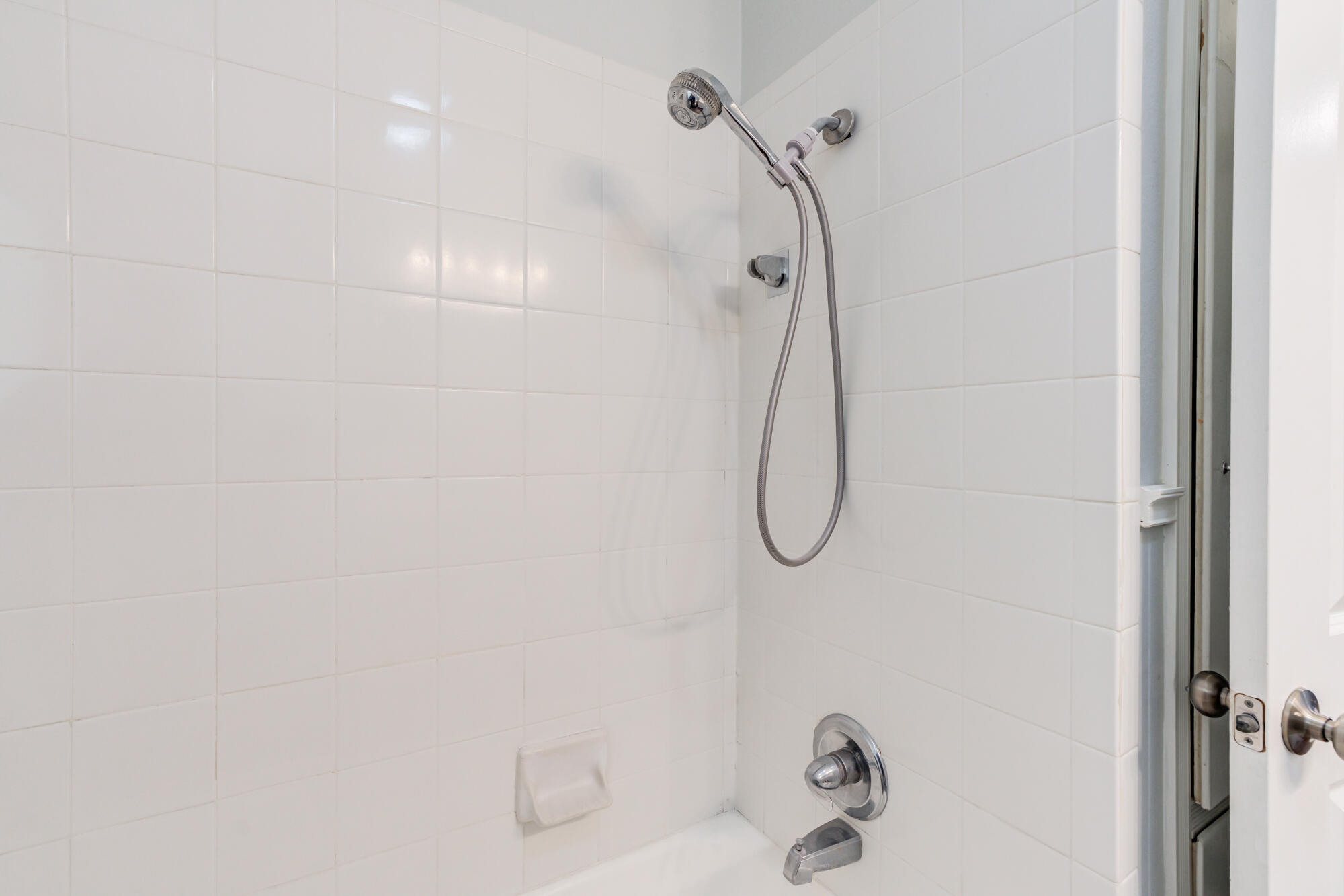 2629 24th Street Lubbock, TX 79410 - Photo 17 of 28 a bathroom with a bath tub with a shower