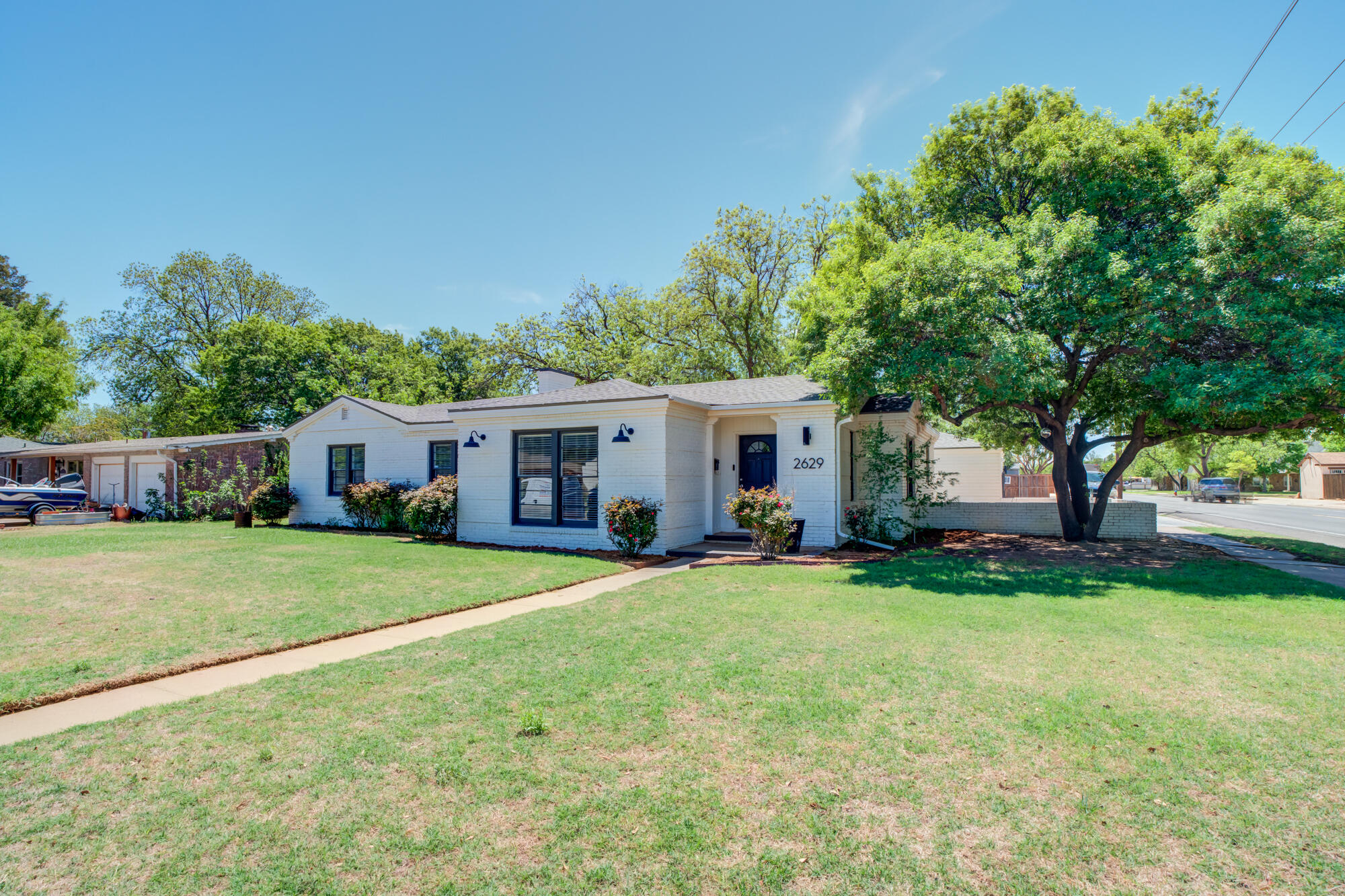 2629 24th Street Lubbock, TX 79410 - Photo 2 of 28 a view of a house with a yard and tree s