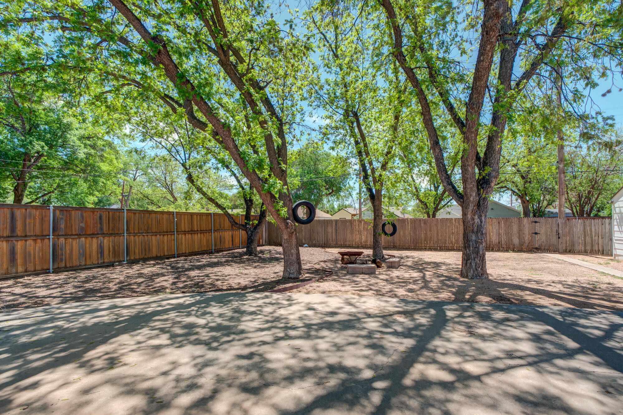 2629 24th Street Lubbock, TX 79410 - Photo 23 of 28 a view of a backyard with trees