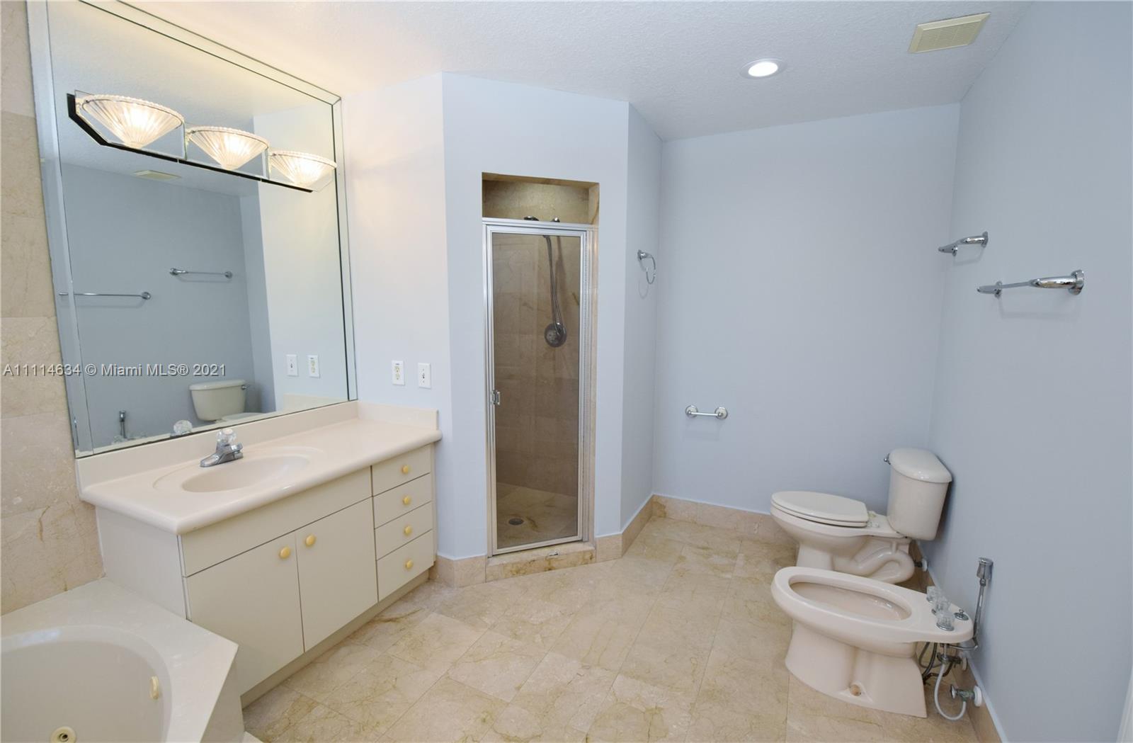 15381 Southwest 112th Terrace Miami, FL 33196 - Photo 20 of 43 a bathroom with a toilet sink and mirror