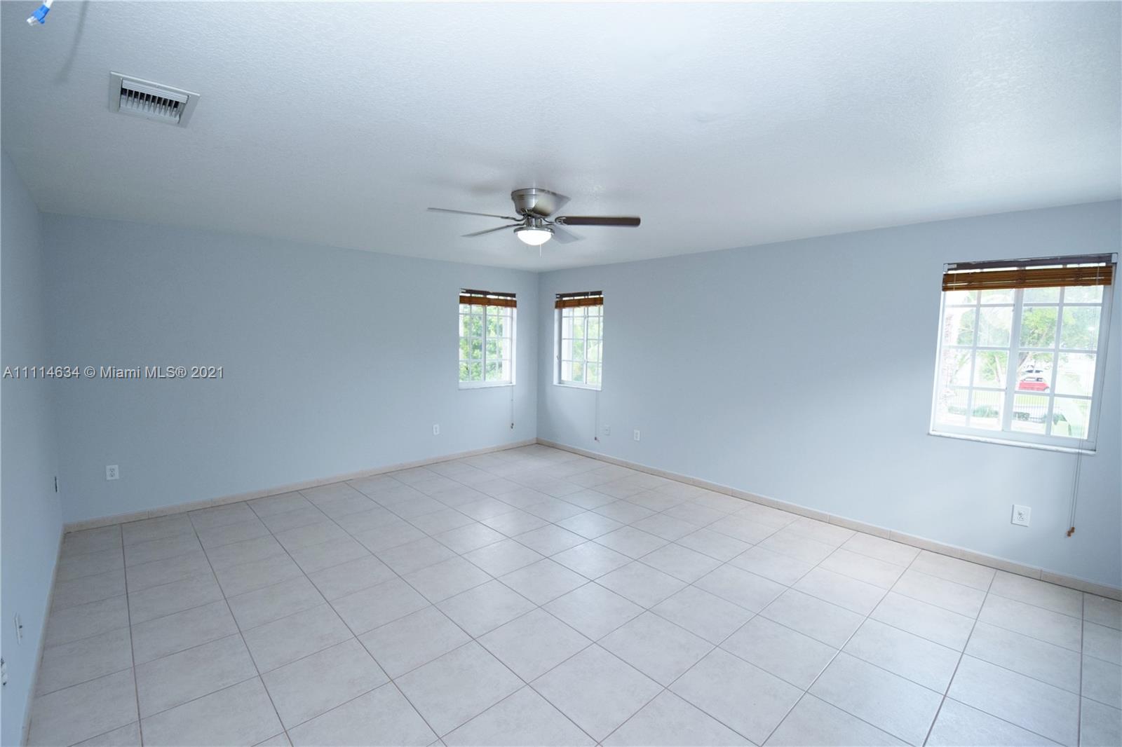 15381 Southwest 112th Terrace Miami, FL 33196 - Photo 22 of 43 an empty room that has a window in it