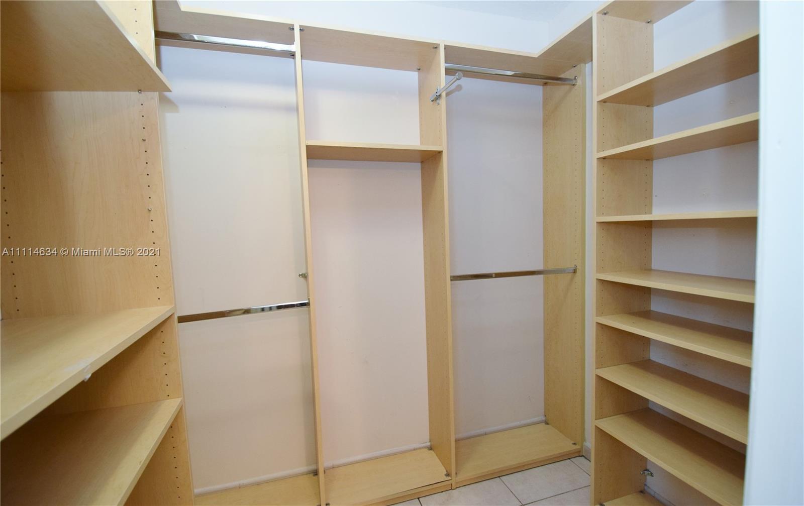 15381 Southwest 112th Terrace Miami, FL 33196 - Photo 24 of 43 a view of walk in closet with empty racks