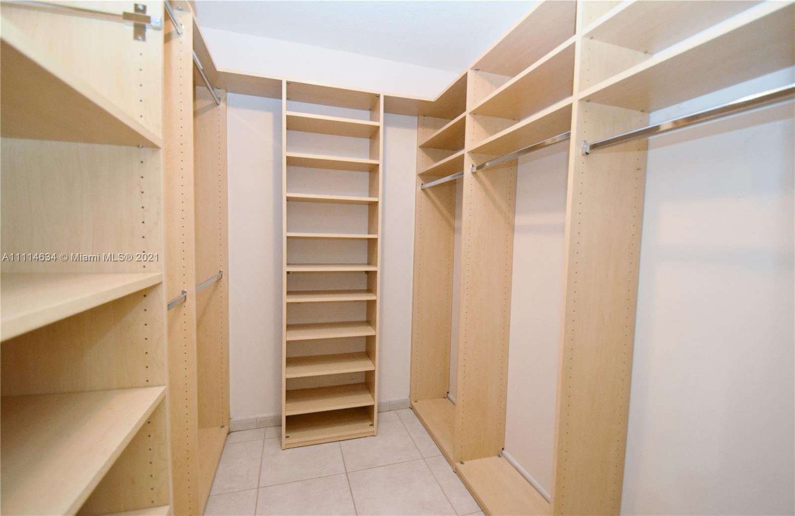 15381 Southwest 112th Terrace Miami, FL 33196 - Photo 25 of 43 a view of walk in closet with empty racks