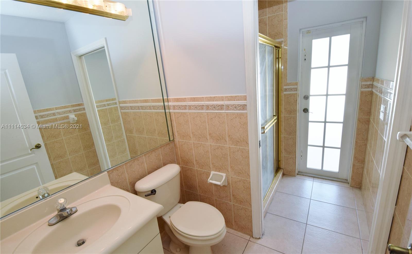 15381 Southwest 112th Terrace Miami, FL 33196 - Photo 26 of 43 a bathroom with a sink toilet and shower