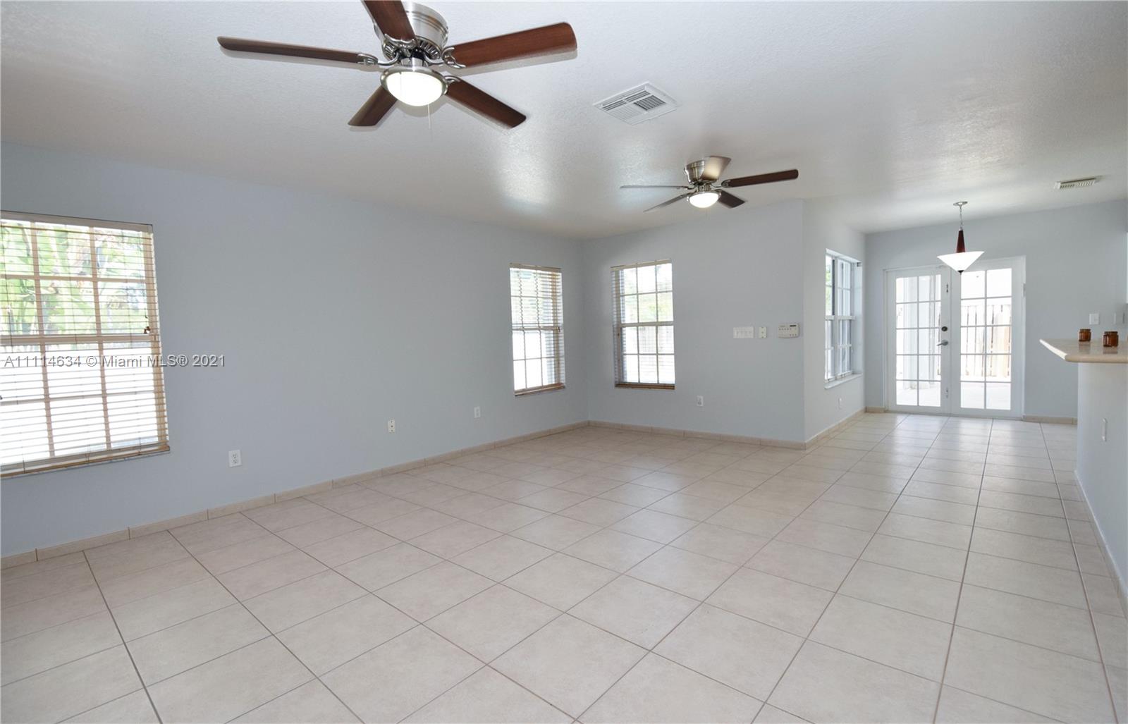 15381 Southwest 112th Terrace Miami, FL 33196 - Photo 28 of 43 a view of an empty room with a window