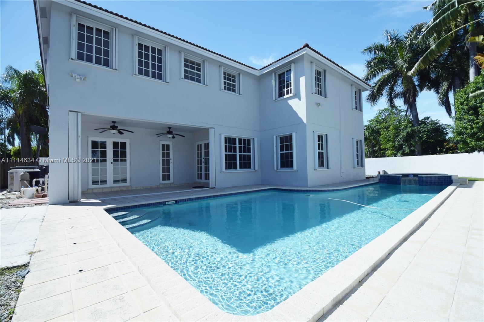 15381 Southwest 112th Terrace Miami, FL 33196 - Photo 3 of 43 a front view of a house with swimming pool