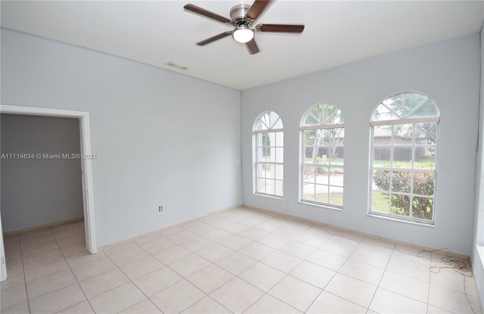 15381 Southwest 112th Terrace Miami, FL 33196 - Photo 31 of 43 a view of an empty room with a window