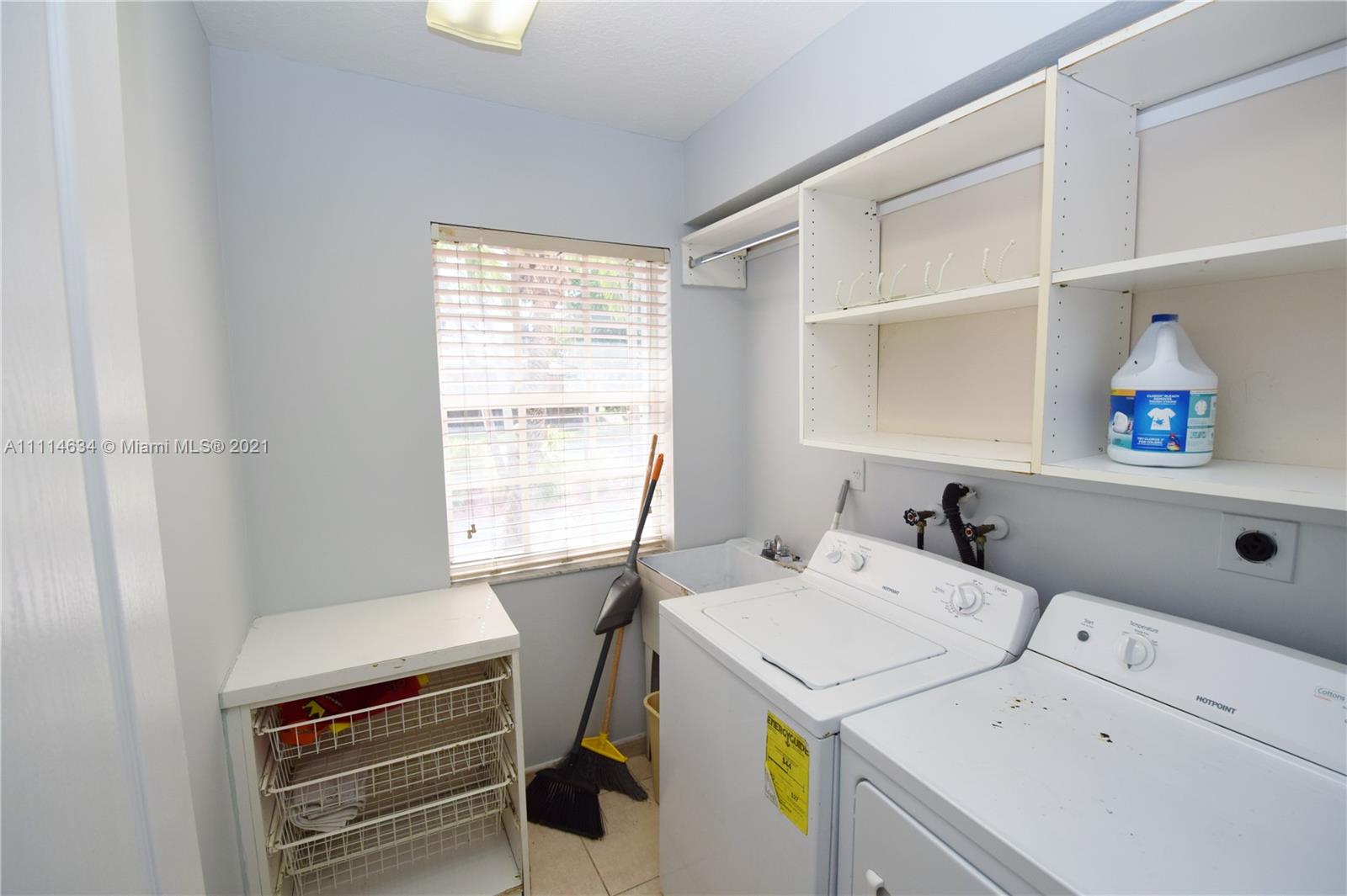 15381 Southwest 112th Terrace Miami, FL 33196 - Photo 34 of 43 a utility room with dryer and washer