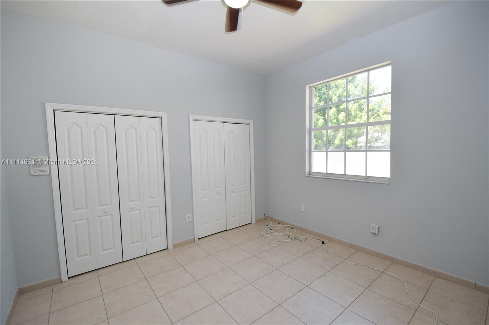 15381 Southwest 112th Terrace Miami, FL 33196 - Photo 35 of 43 a view of an empty room with a window