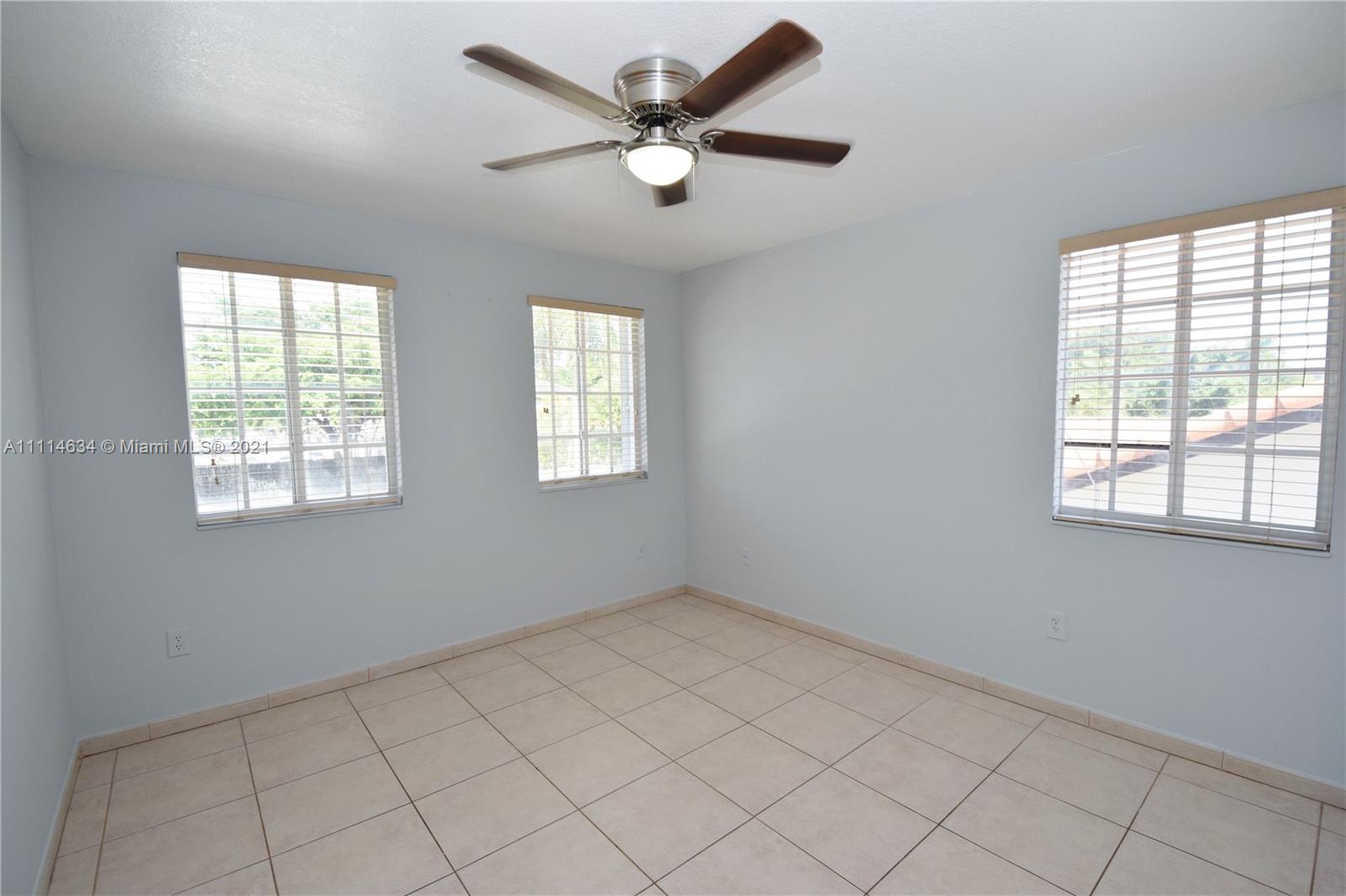 15381 Southwest 112th Terrace Miami, FL 33196 - Photo 39 of 43 a view of an empty room with a window