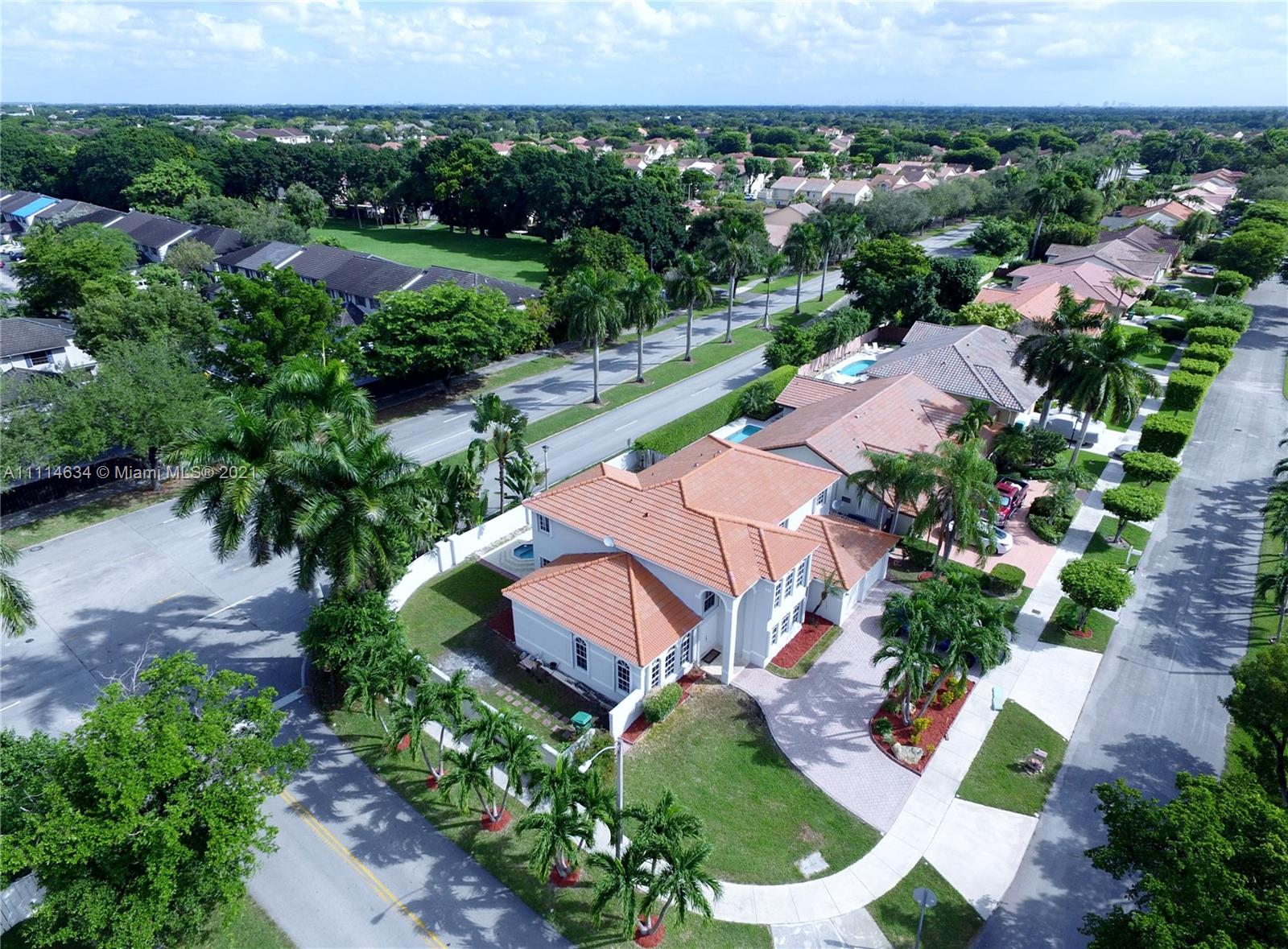 15381 Southwest 112th Terrace Miami, FL 33196 - Photo 5 of 43 an aerial view of a house with a garden