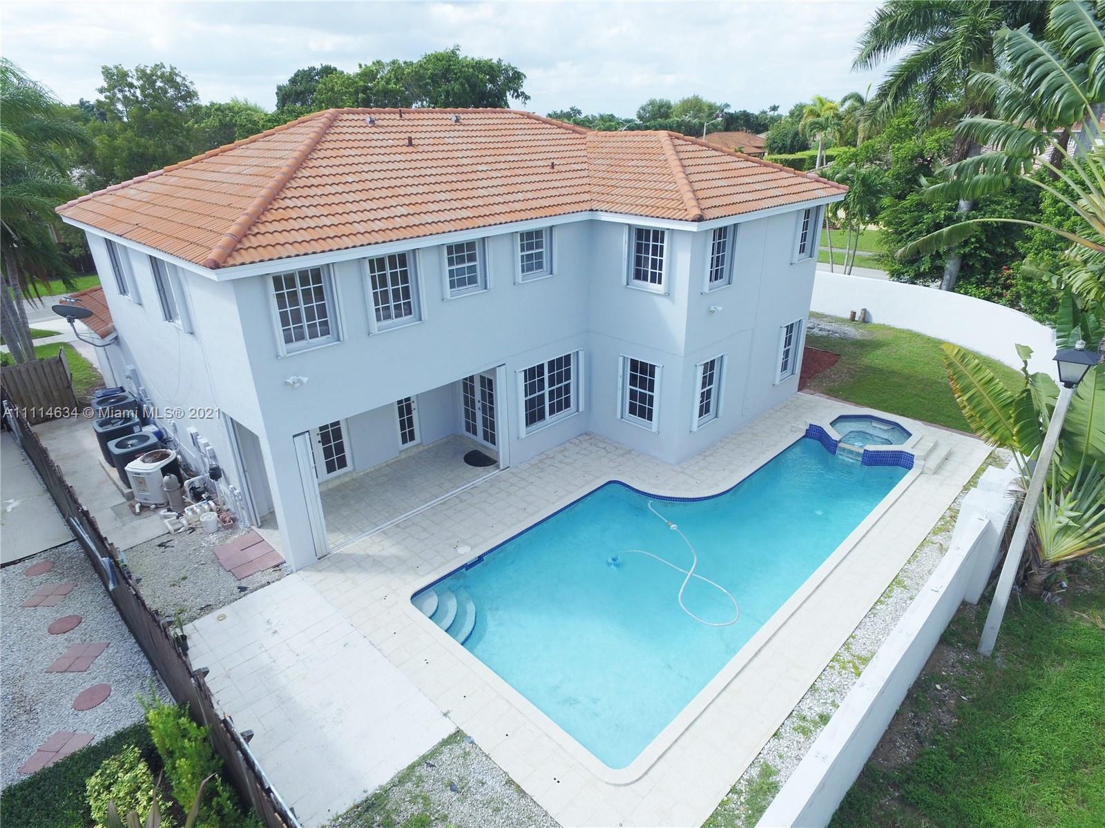 15381 Southwest 112th Terrace Miami, FL 33196 - Photo 41 of 43 a aerial view of a house with table and chairs