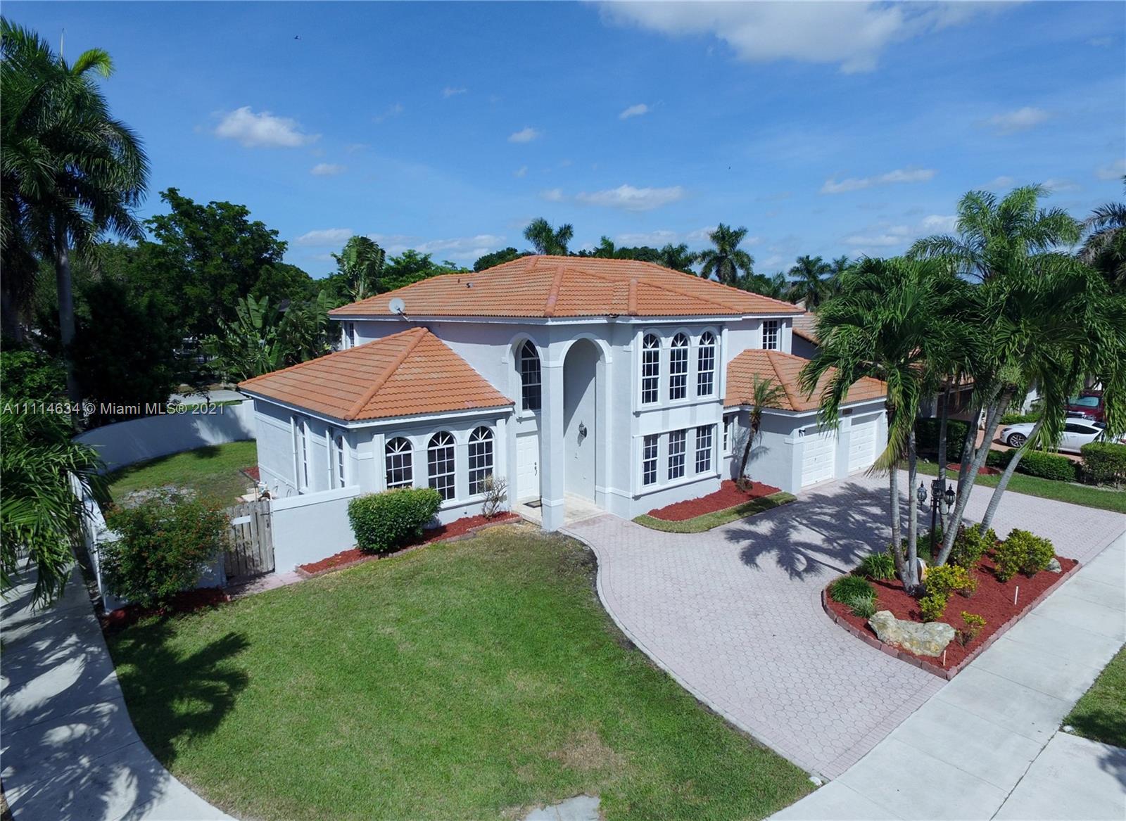 15381 Southwest 112th Terrace Miami, FL 33196 - Photo 42 of 43 a front view of a house with a garden