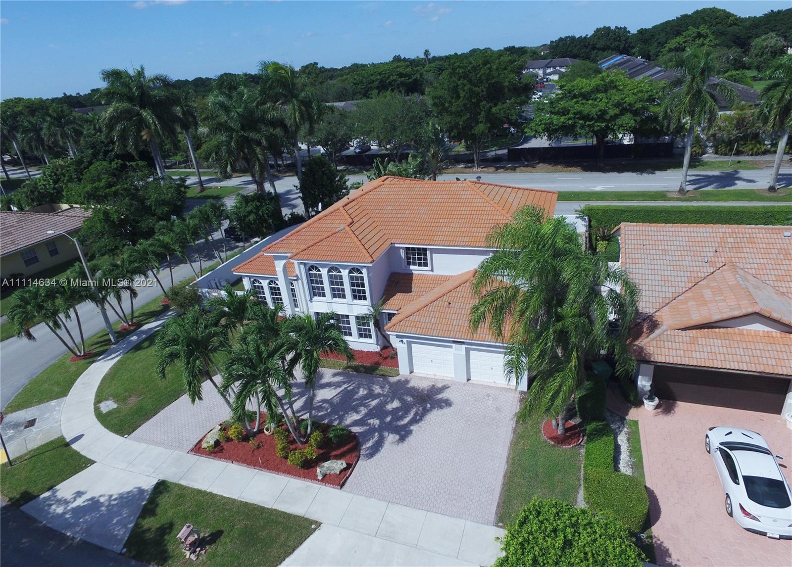 15381 Southwest 112th Terrace Miami, FL 33196 - Photo 6 of 43 an aerial view of a house with garden space and a patio
