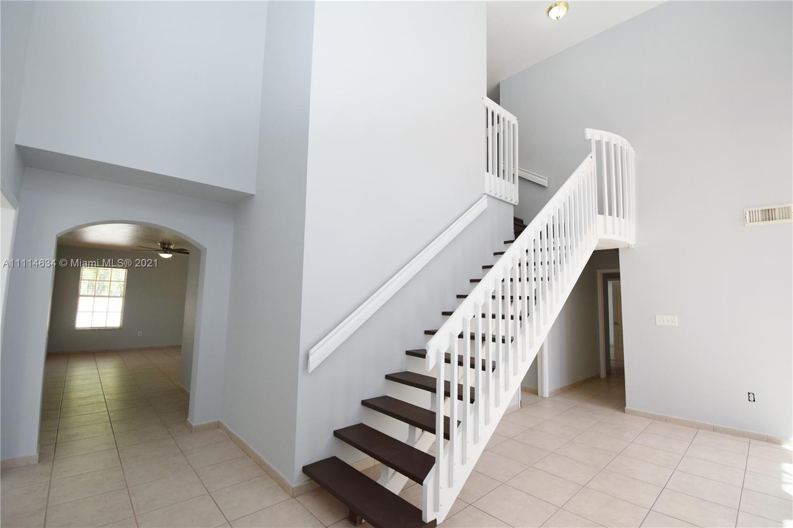 15381 Southwest 112th Terrace Miami, FL 33196 - Photo 7 of 43 a view of entryway and hall with wooden floor