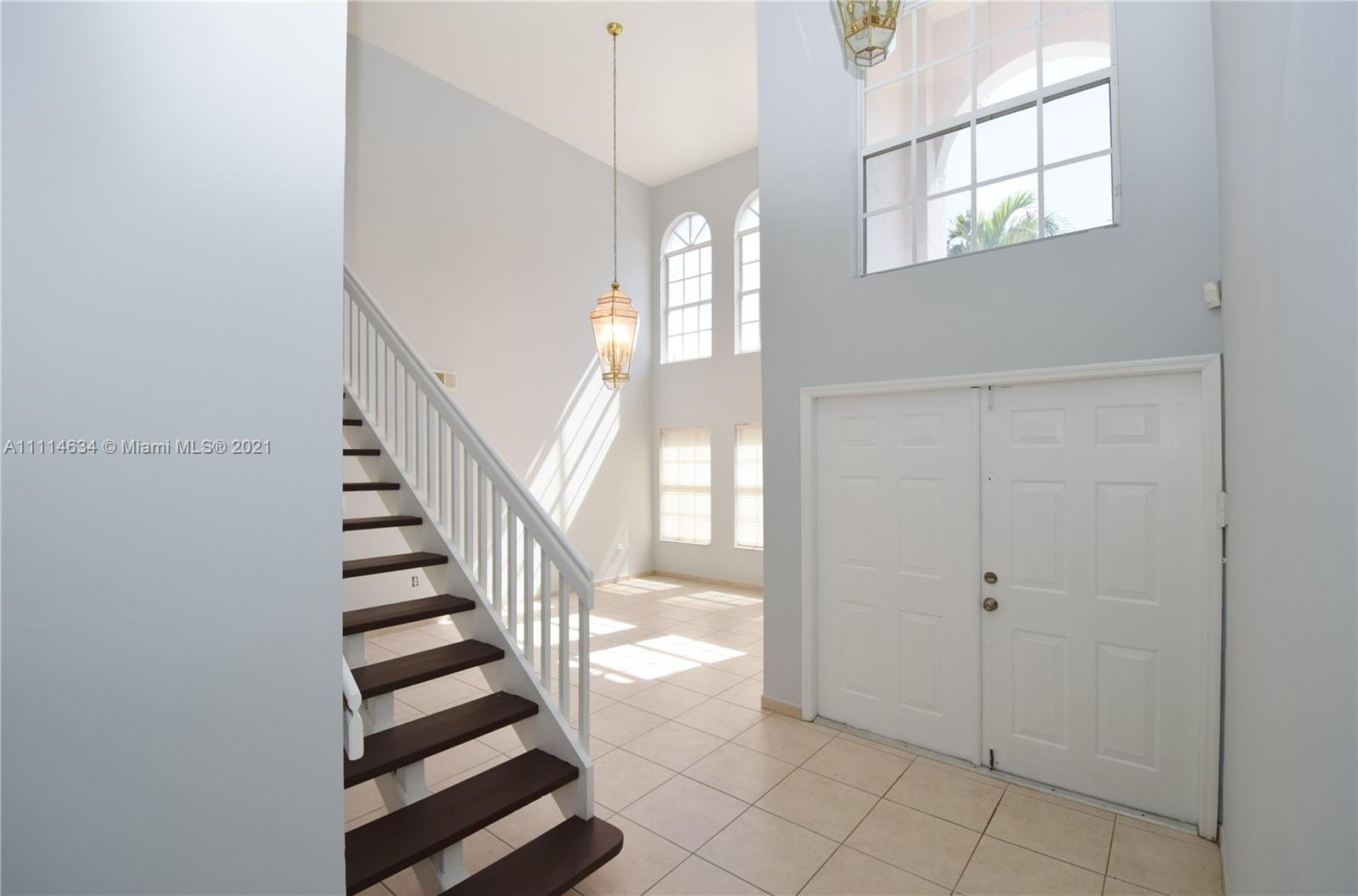 15381 Southwest 112th Terrace Miami, FL 33196 - Photo 9 of 43 a view of entryway and hall with wooden floor