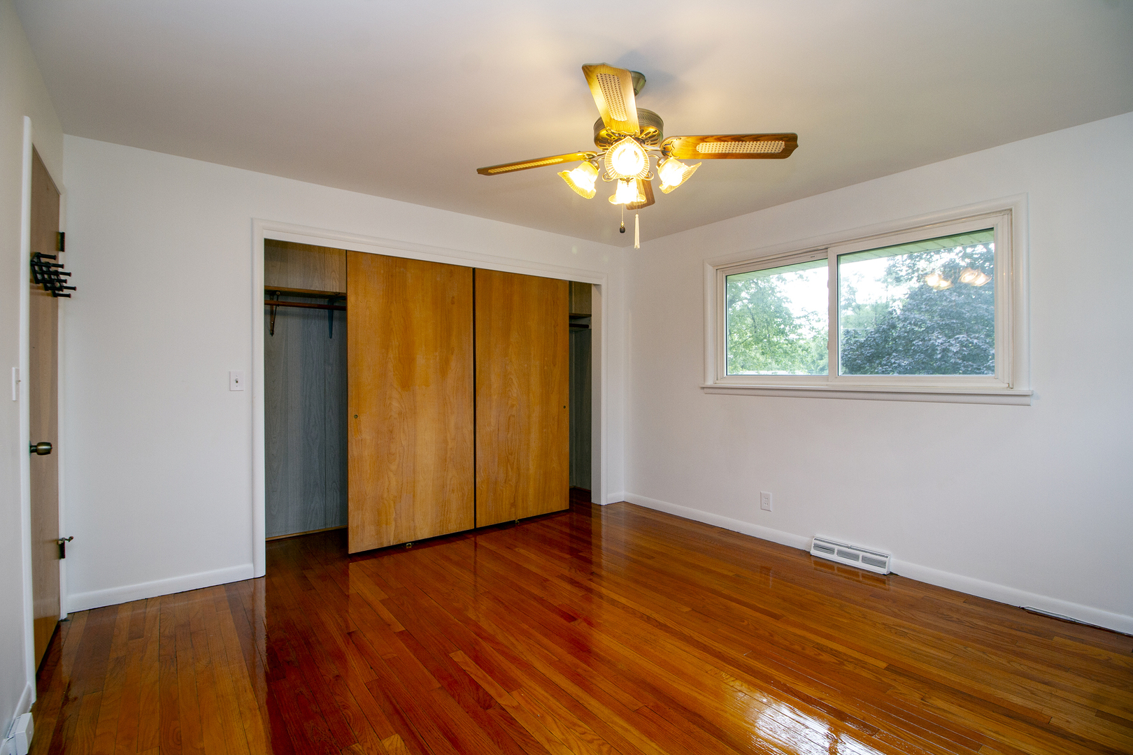 19 Durell Drive Kankakee, IL 60901 - Photo 13 of 25 a view of an empty room with wooden floor and a window
