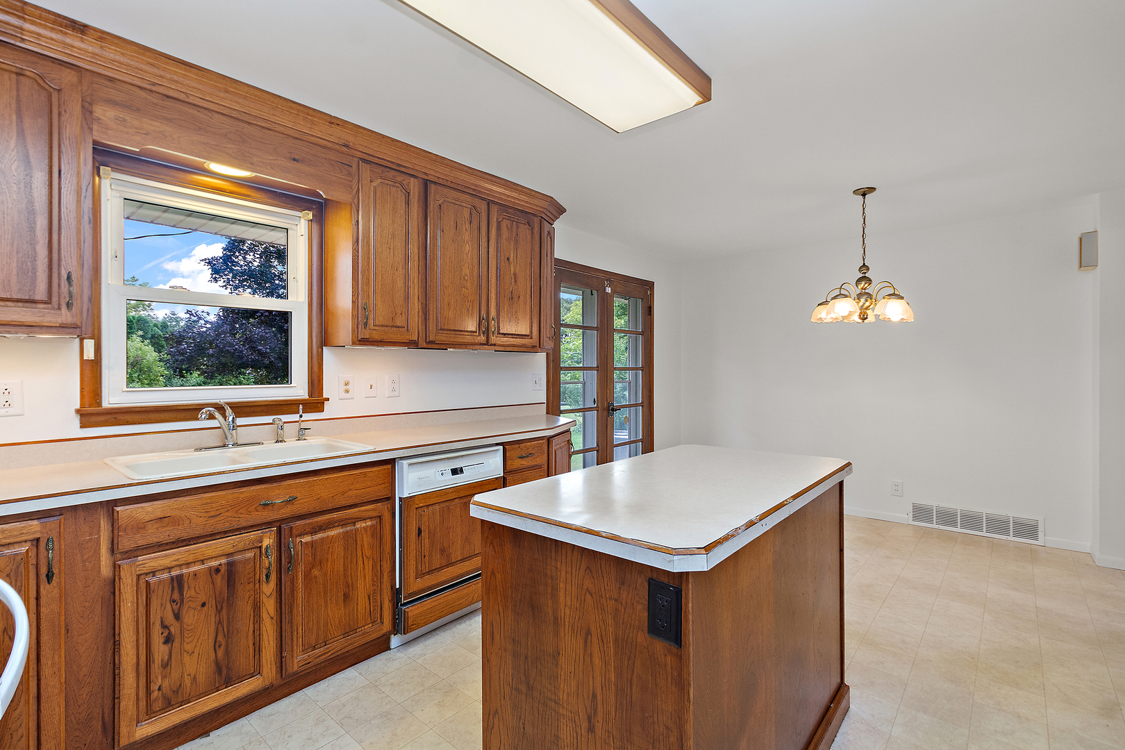 19 Durell Drive Kankakee, IL 60901 - Photo 7 of 25 a kitchen that has a sink and a stove in it