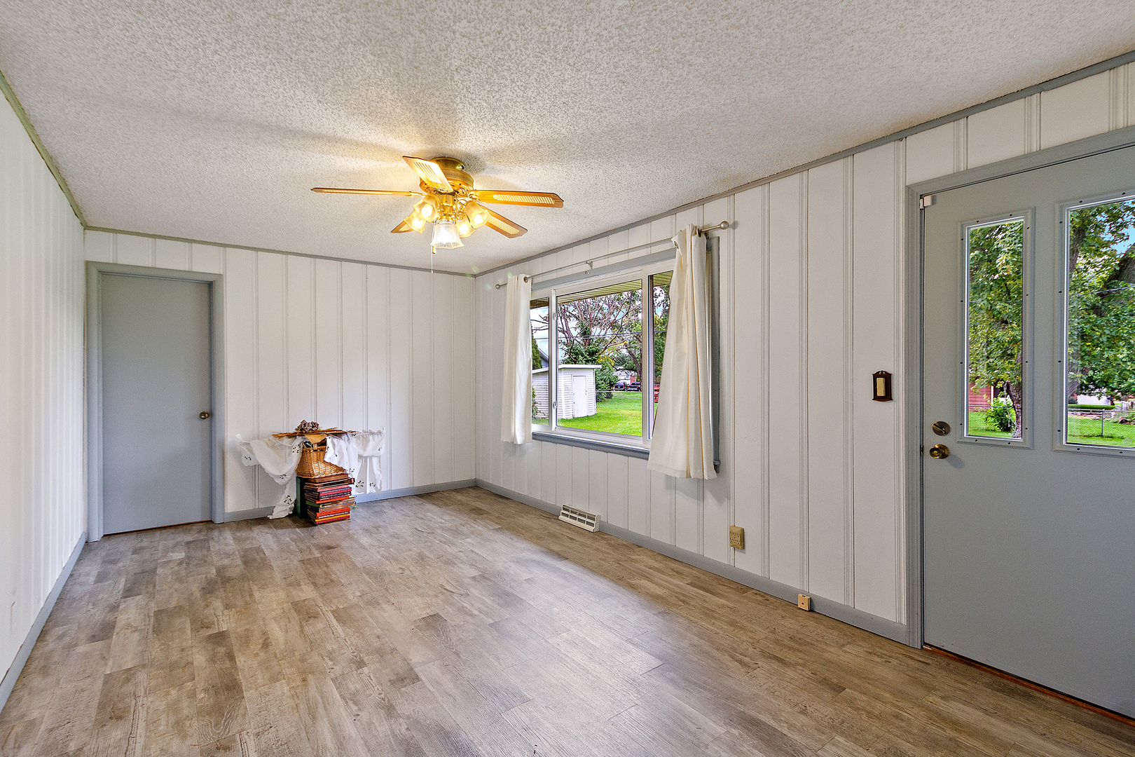 19 Durell Drive Kankakee, IL 60901 - Photo 10 of 25 wooden floor in an empty room with a window