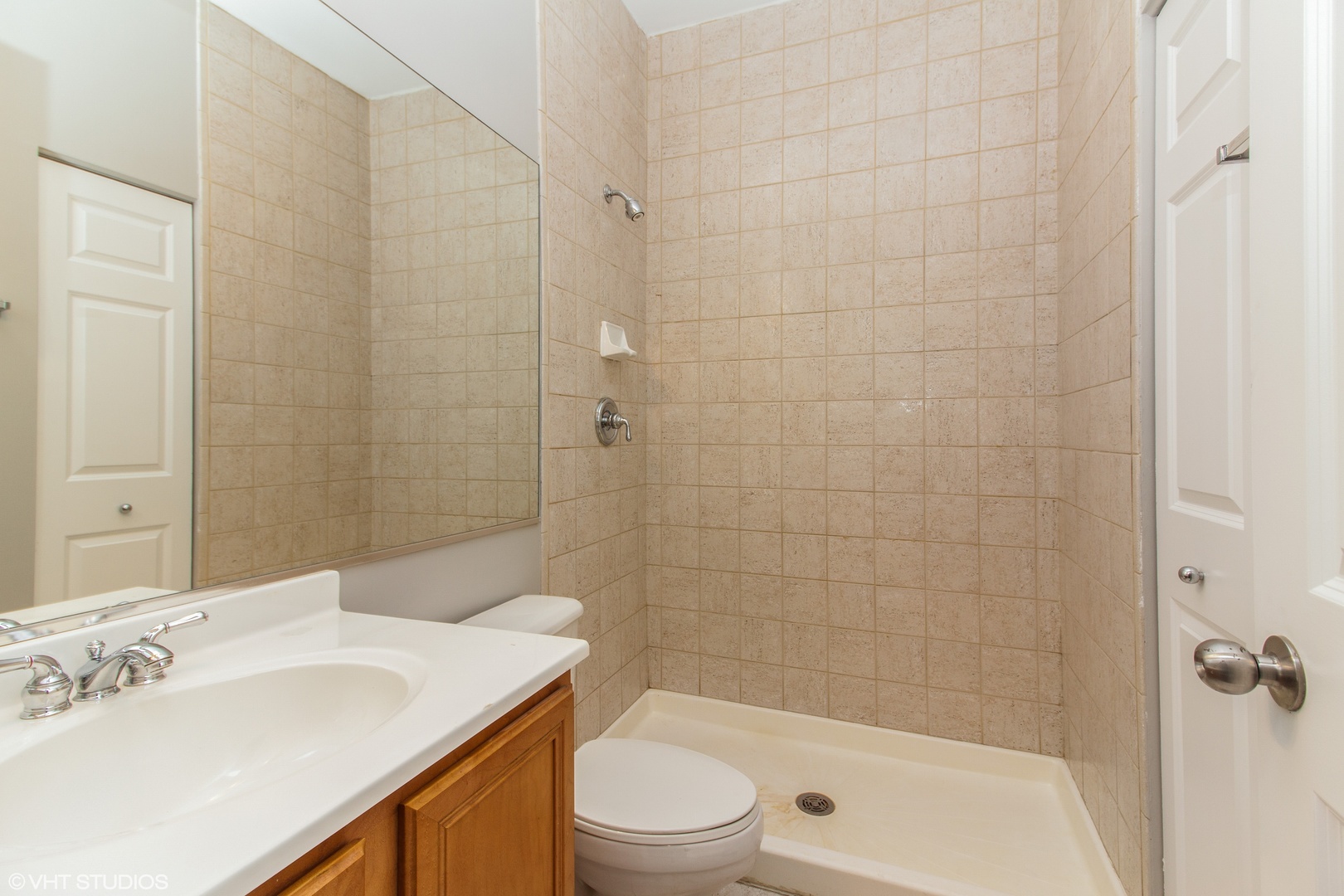 1443 West Fillmore Street, Unit B Chicago, IL 60607 - Photo 14 of 20 a bathroom with a sink a toilet and shower