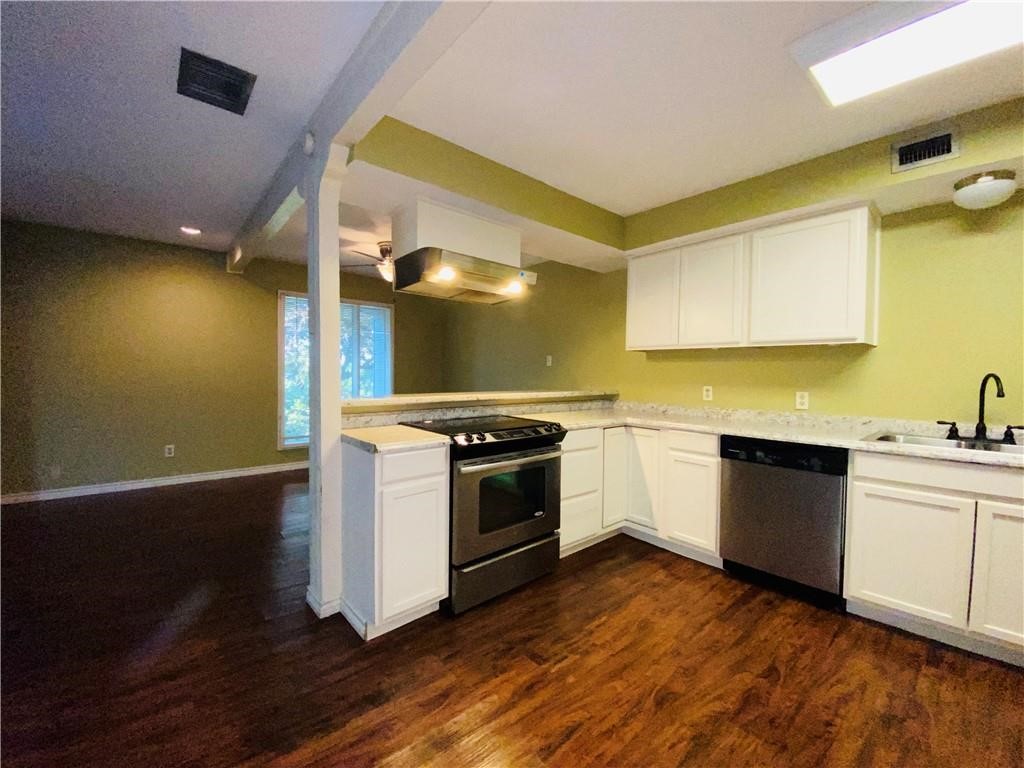 310 Sunset Boulevard Portland, TX 78374 - Photo 4 of 18 a kitchen with a sink and wooden floor