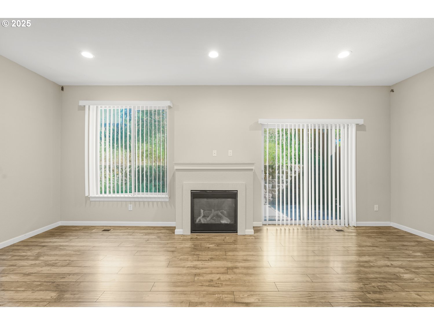 3804 Nicholson Road Vancouver, WA 98661 - Photo 2 of 24 a view of an empty room with wooden floor and a window