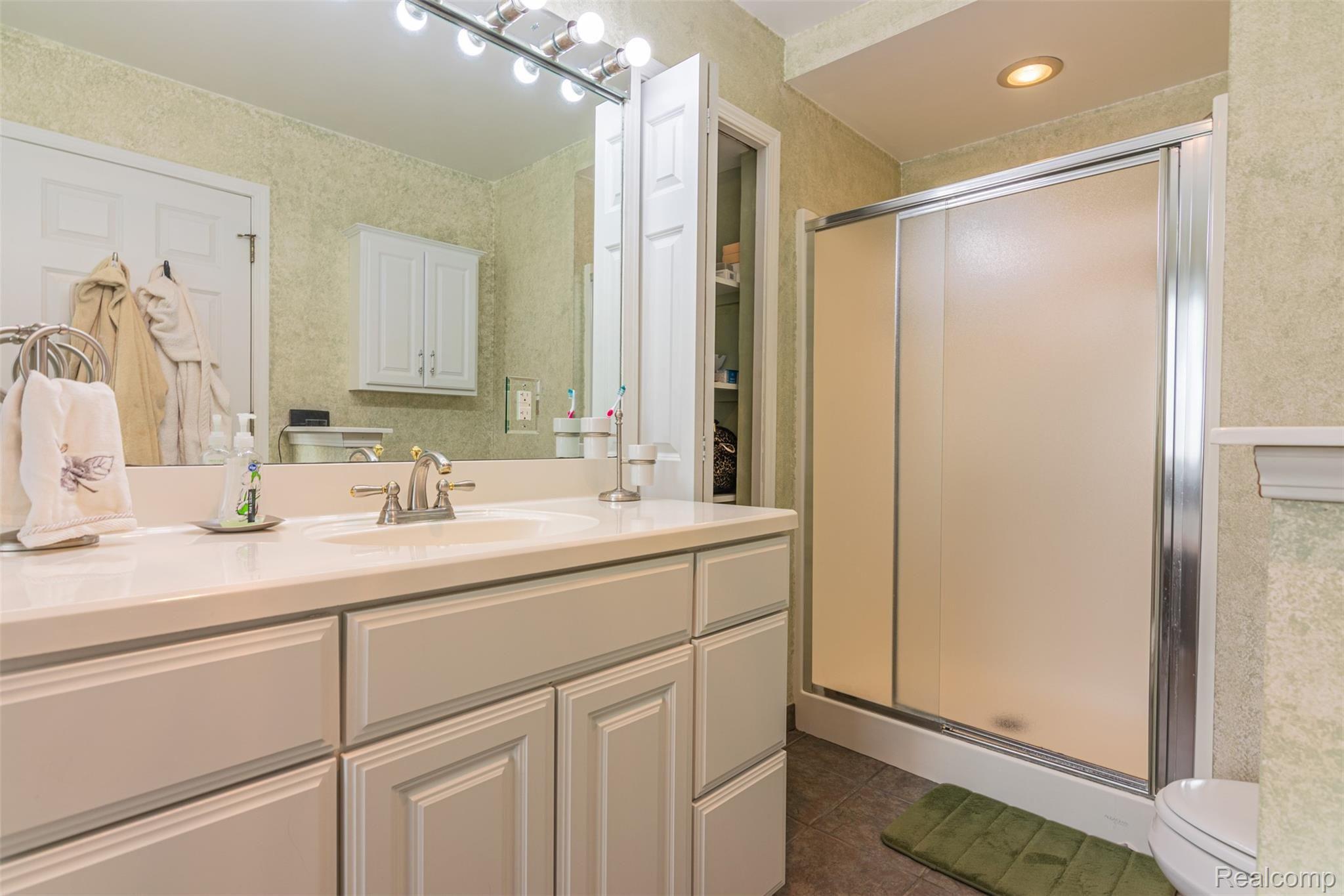 10151 Meskill Road Columbus, MI 48063 - Photo 19 of 39 Master bath also features a shower, linen closet, and large vanity.