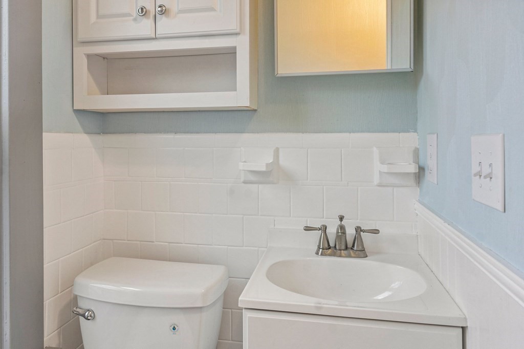 2191 Main Street Three Rivers, MA 01080 - Photo 27 of 42 a bathroom with a sink a toilet and mirror