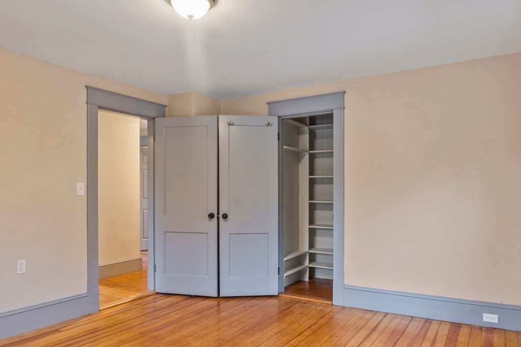 2191 Main Street Three Rivers, MA 01080 - Photo 29 of 42 a view of an empty room with wooden floor closet and a window