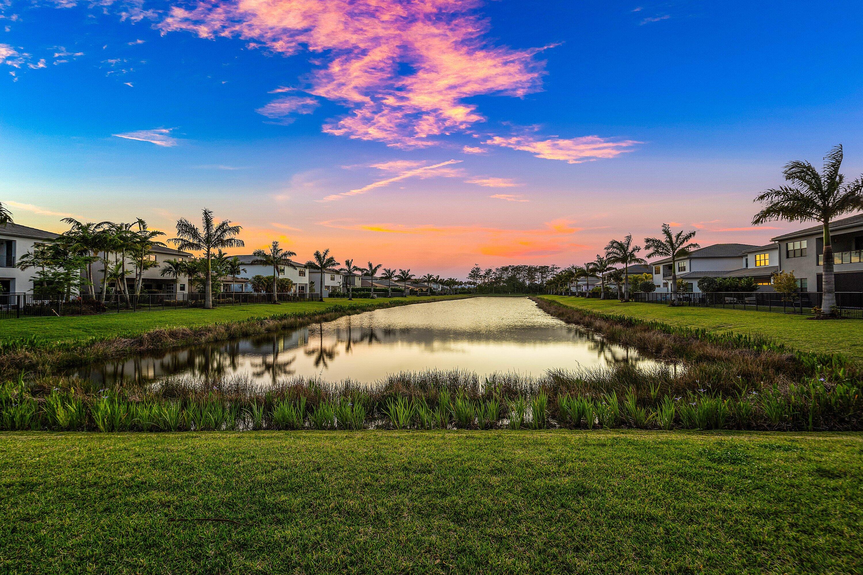 20197 Castle Stuart Avenue Boca Raton, FL 33434 - Photo 12 of 43 a view of a lake with houses in the back