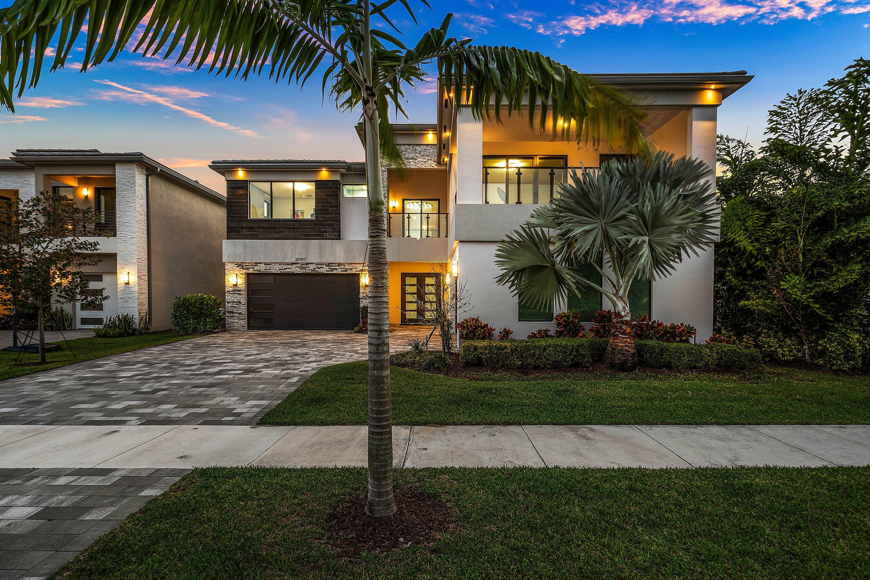 20197 Castle Stuart Avenue Boca Raton, FL 33434 - Photo 3 of 43 a front view of house with yard and green space