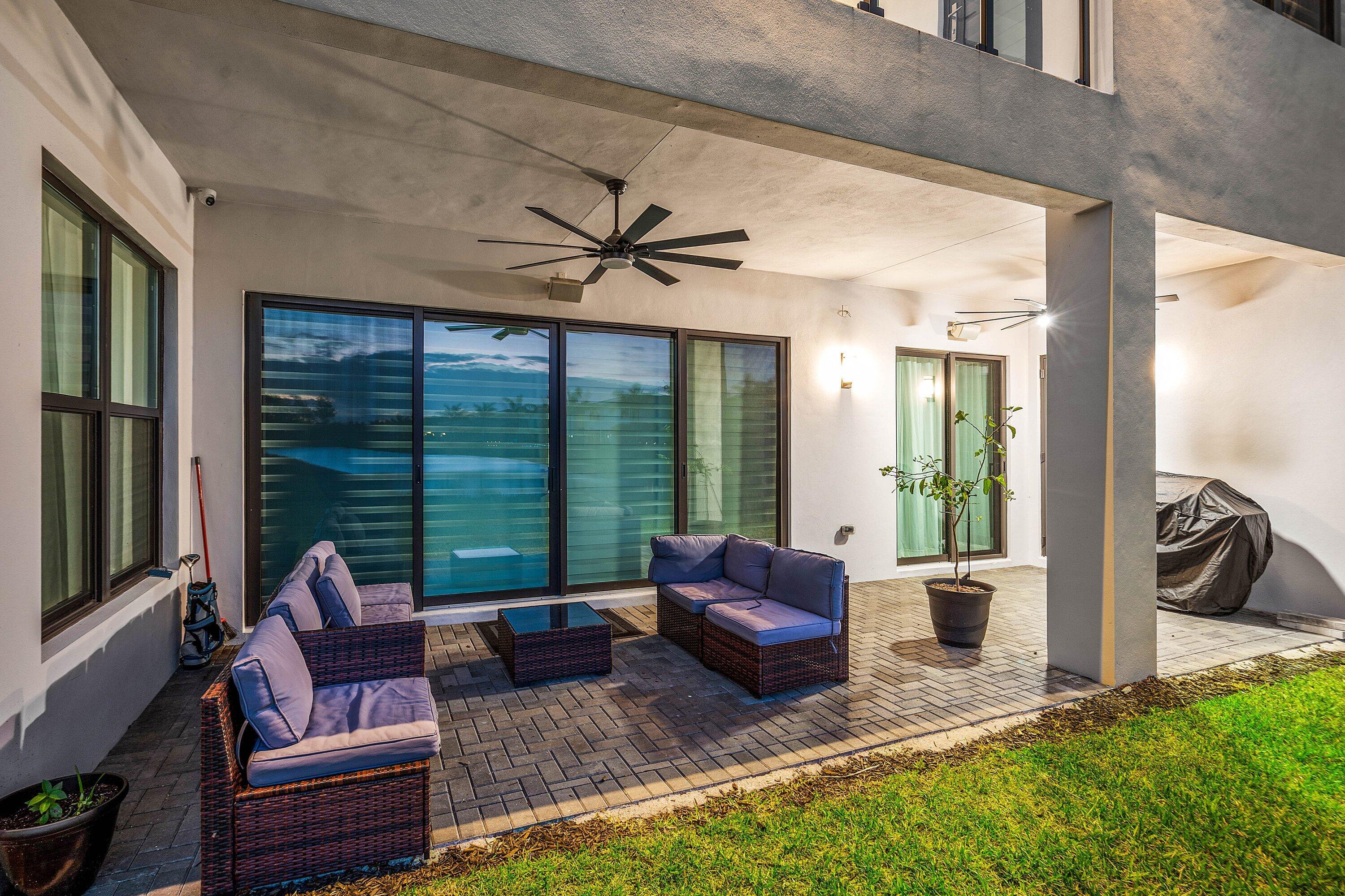 20197 Castle Stuart Avenue Boca Raton, FL 33434 - Photo 9 of 43 a living room with furniture floor to ceiling window and a floor to ceiling window