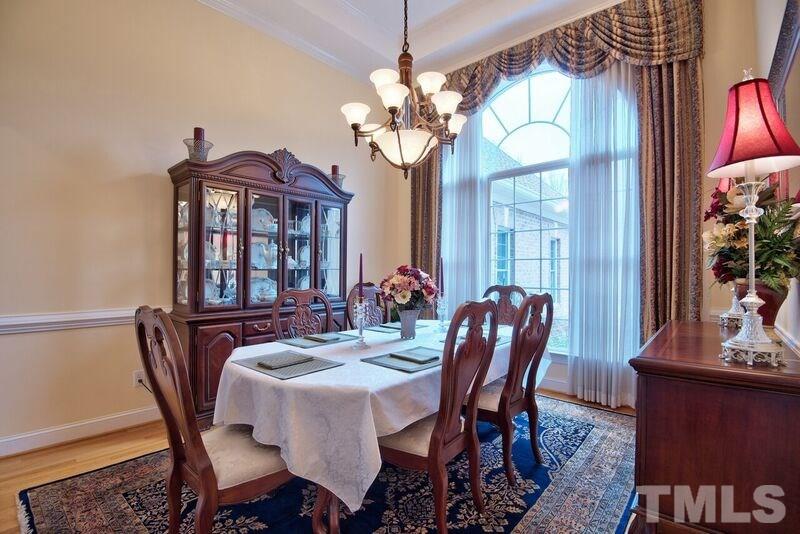 1815 Helena Moriah Road Timberlake, NC 27583 - Photo 11 of 23 a dining room with furniture potted plants and wooden floor