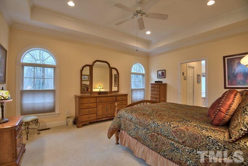 1815 Helena Moriah Road Timberlake, NC 27583 - Photo 14 of 23 a bedroom with a bed and a dresser